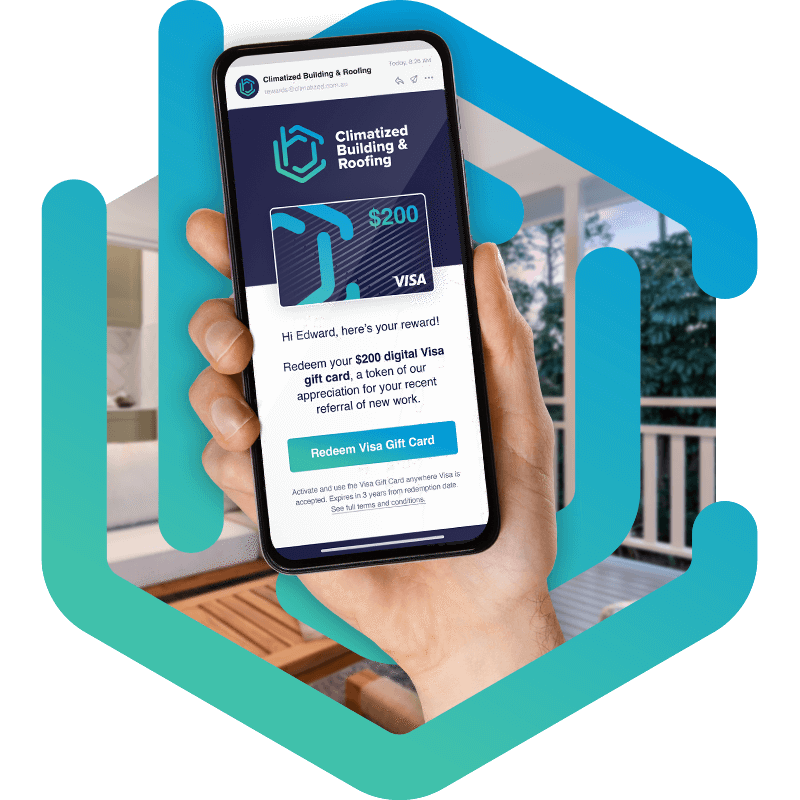 Hand holding phone with Visa gift card on screen